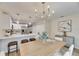 Bright dining room with wood table, chandelier, and view of backyard at 1006 Hagle Park Rd, Bradenton, FL 34212