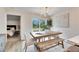 Dining area with sliding glass doors to backyard and view of bedroom at 1006 Hagle Park Rd, Bradenton, FL 34212