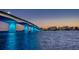 Aerial view of a bridge at sunset with city skyline in the background at 3320 Gulf Of Mexico Drive # 208C, Longboat Key, FL 34228