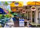 Outdoor seating area of a tropical bar and restaurant at 3320 Gulf Of Mexico Drive # 208C, Longboat Key, FL 34228