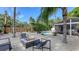 Landscaped backyard with a fire pit and a pool at 4844 Brywill Cir, Sarasota, FL 34234