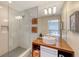 Clean bathroom with a walk-in shower and modern vanity at 4844 Brywill Cir, Sarasota, FL 34234