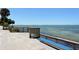 Bayfront walkway with blue bench and scenic view at 4844 Brywill Cir, Sarasota, FL 34234