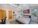 Modern bedroom with light flooring and a view of the backyard at 4844 Brywill Cir, Sarasota, FL 34234