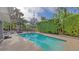 Clean rectangular pool with a large concrete patio at 4844 Brywill Cir, Sarasota, FL 34234