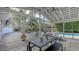 Relaxing screened patio with seating and view of the pool at 4844 Brywill Cir, Sarasota, FL 34234