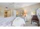 Charming bedroom with a king bed and access to balcony at 6713 Stone River Rd # 104, Bradenton, FL 34203