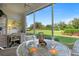 Bright sunroom with table and chairs at 6713 Stone River Rd # 104, Bradenton, FL 34203