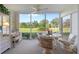 Spacious sunroom overlooking the golf course at 6713 Stone River Rd # 104, Bradenton, FL 34203