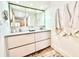 Modern bathroom with double vanity, large mirror and a walk-in shower at 707 S Gulfstream Ave # 604, Sarasota, FL 34236