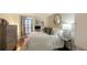 Well-lit bedroom with a queen-size bed and access to a private balcony at 707 S Gulfstream Ave # 604, Sarasota, FL 34236