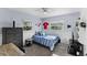 Cozy bedroom with twin-size bed and built-in shelving at 7146 Territory Ln, Sarasota, FL 34240