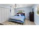 Comfortable bedroom with a queen-size bed and light blue walls at 7146 Territory Ln, Sarasota, FL 34240