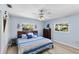 Relaxing bedroom with a king-size bed and light blue walls at 7146 Territory Ln, Sarasota, FL 34240