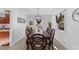 Formal dining room with a large wood table and six chairs at 7146 Territory Ln, Sarasota, FL 34240