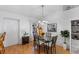 Bright dining room with glass-top table and wood chairs at 7146 Territory Ln, Sarasota, FL 34240