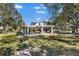 Barn-style garage with covered patio and yard space at 7146 Territory Ln, Sarasota, FL 34240