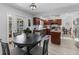 Modern kitchen with granite countertops, stainless steel appliances, and an island at 7146 Territory Ln, Sarasota, FL 34240