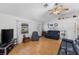 Living room with hardwood floors and comfy leather couches at 7146 Territory Ln, Sarasota, FL 34240