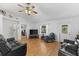 Living room featuring hardwood floors and two leather sofas at 7146 Territory Ln, Sarasota, FL 34240