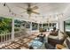 Relaxing patio area with seating and string lights overlooking the pool at 7146 Territory Ln, Sarasota, FL 34240