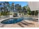 Inviting kidney-shaped pool with brick pavers and a covered patio at 7146 Territory Ln, Sarasota, FL 34240