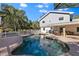 Enjoyable kidney-shaped pool with brick patio and house view at 7146 Territory Ln, Sarasota, FL 34240