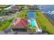 Aerial view of community pool, tennis court, and waterfront homes at 1309 3Rd Street E Cir, Palmetto, FL 34221