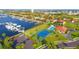 Aerial view of waterfront community with tennis court and pool at 1309 3Rd Street E Cir, Palmetto, FL 34221