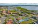 Aerial view of community near waterfront with tennis court at 1309 3Rd Street E Cir, Palmetto, FL 34221