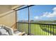 Screened balcony overlooking the water and lush landscape at 1309 3Rd Street E Cir, Palmetto, FL 34221