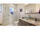 Elegant bathroom with marble shower, glass sink, and modern vanity at 1309 3Rd Street E Cir, Palmetto, FL 34221