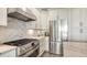 Modern kitchen with stainless steel appliances and white cabinetry at 1309 3Rd Street E Cir, Palmetto, FL 34221