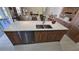 Modern kitchen island featuring a stainless steel dishwasher and counter seating at 1859 Lamont St, North Port, FL 34288