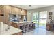 Modern kitchen features a large island with seating and stainless steel appliances at 1859 Lamont St, North Port, FL 34288