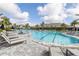 Resort-style pool with comfortable lounge chairs and paved patio at 4611 Trento Pl, Bradenton, FL 34211