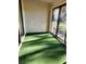 Sunroom with green carpeting and large windows at 5496 Hampstead Heath # 10, Sarasota, FL 34235