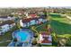 Aerial view showing the community pool, building, and golf course at 6059 Bahia Del Mar Blvd # 239, St Petersburg, FL 33715