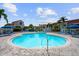 Inviting kidney-shaped pool with plenty of lounge chairs at 6059 Bahia Del Mar Blvd # 239, St Petersburg, FL 33715