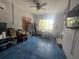 Sunroom with blue floor, large window, and ceiling fan at 633 Calle De Peru, Sarasota, FL 34242