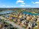 Aerial view of a house in a residential neighborhood near a lake at 6614 38Th E St, Sarasota, FL 34243