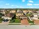 Aerial view of two-story house with a two-car garage and landscaped yard at 6614 38Th E St, Sarasota, FL 34243