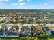 Aerial view of community with various houses and a lake at 6614 38Th E St, Sarasota, FL 34243