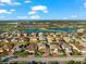 Aerial view of a two-story house with a landscaped yard at 6614 38Th E St, Sarasota, FL 34243