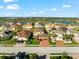 Aerial view of a two-story house with a two-car garage, and a basketball court at 6614 38Th E St, Sarasota, FL 34243