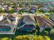 Aerial view of house with pool and screened enclosure at 6614 38Th E St, Sarasota, FL 34243