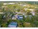 Aerial view of the property showing house, pool, and surrounding neighborhood at 6623 Glades Way, Sarasota, FL 34231