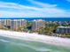 Aerial view of multiple condo buildings and a beautiful beach at 1211 Gulf Of Mexico Dr # 706, Longboat Key, FL 34228