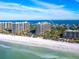 Aerial view of oceanfront condo building, white sand beach at 1211 Gulf Of Mexico Dr # 706, Longboat Key, FL 34228