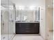 Double vanity bathroom with a large glass shower at 1211 Gulf Of Mexico Dr # 706, Longboat Key, FL 34228